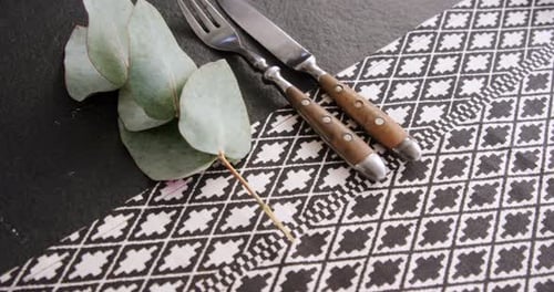 Table Setting with Silverware and Eucalyptus