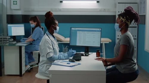 Doctor consults Patient in Brightly Lit Office