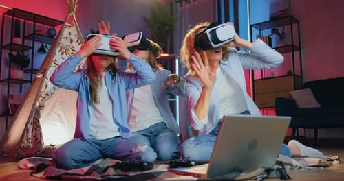 Excited Family Wearing VR Headsets Together at Home