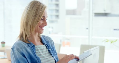 Smiling Woman Working in Bright Modern Office