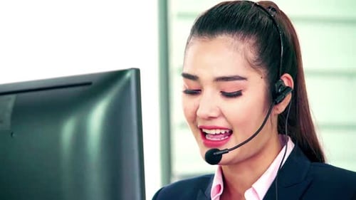 Business People Wearing Headset Working in Office