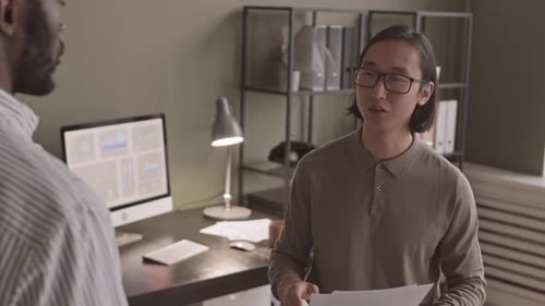 Multiethnic Colleagues Talking in Office