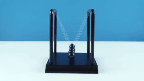 Swinging Spheres of a Newton's Cradle