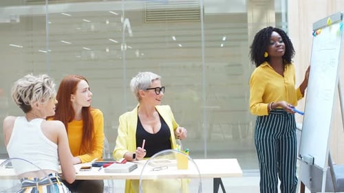 Women Collaborating in Modern Office Meeting