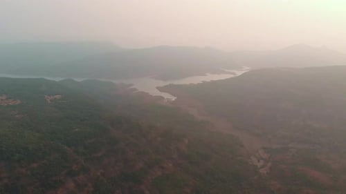 Drone shot flying towards a drying reservoir