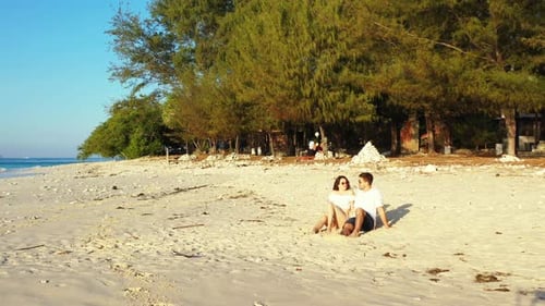 Happy Man and Woman on Honeymoon Vacation Spend Quality Time on Beach on Sunny White Sandy