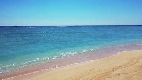 Sea waves sand tropical beach clear bright blue sky summer vacation concept