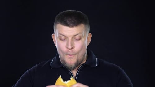 Man Eats Burger in Close Up
