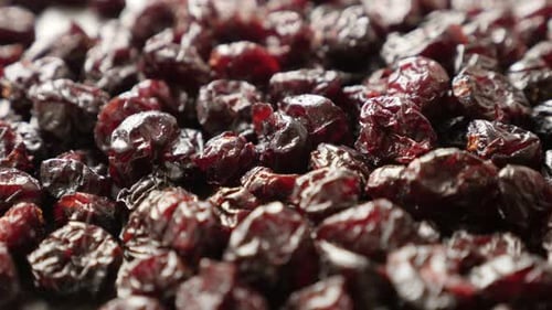 Healthy red cranberries on table slow tilt 4K 2160p 30fps UltraHD footage - Close-up of dried berrie