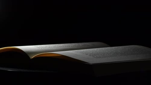 Close Up of Open Book in the Dark