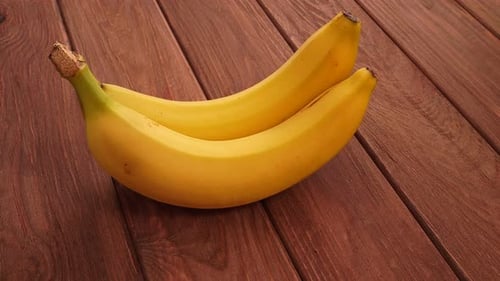Two Fresh Bananas on Wooden Surface