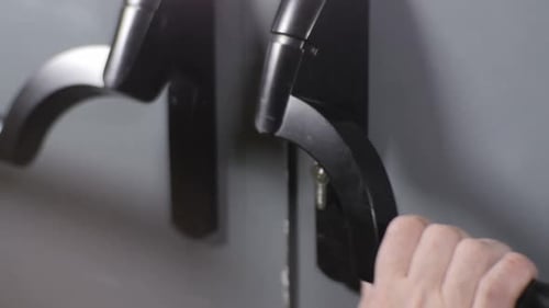Hand Opens Interior Door Using Black Door Handle