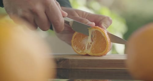 Slicing Orange Mandarin Segments on Cutting Board