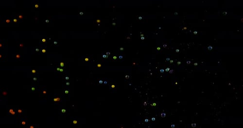 Bright Spheres Floating on Black Background