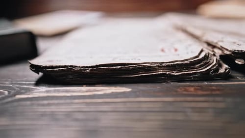 Open Antique Book on Rustic Wooden Table
