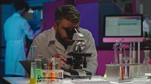 Bearded Scientist Studying Sample
