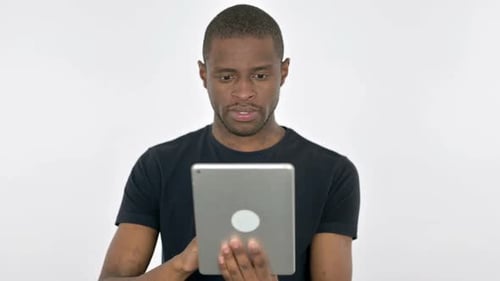 Young adult man using tablet device
