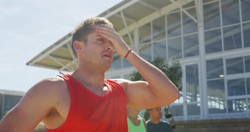 Caucasian man tiring after training