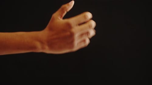 Hand Opening from a Fist on Black