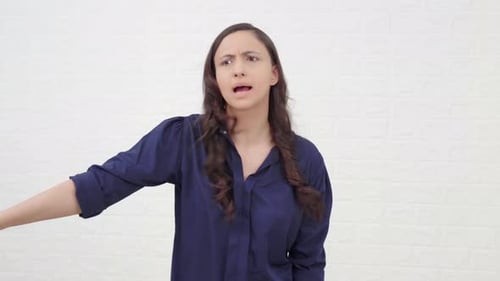 Frustrated Woman Expresses Negative Emotion Indoors