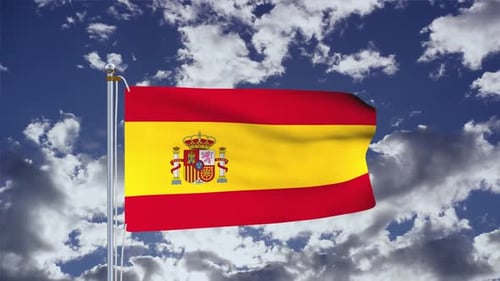 Waving Spain Flag with Coat of Arms Against Blue Sky