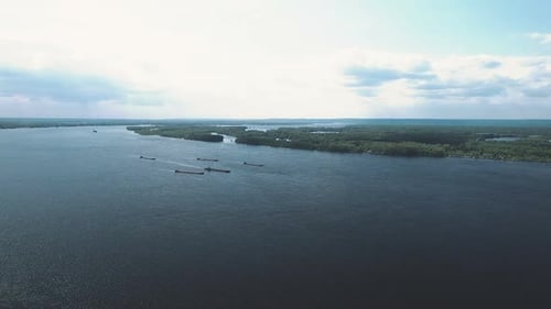 View From a Quadcopter To the River, Barges Are Sailing. River with Islands, Aerial View. Samara