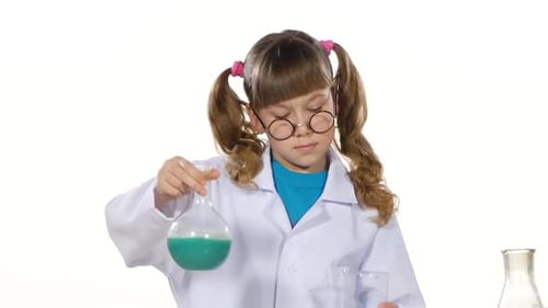 Young Girl Scientist Conducting Science Experiment in Lab
