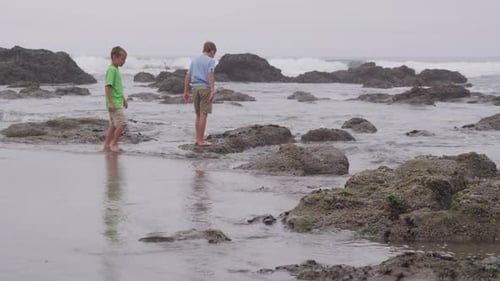 Two young boys at beach. Shot on RED EPIC for high quality 4K, UHD, Ultra HD resolution.