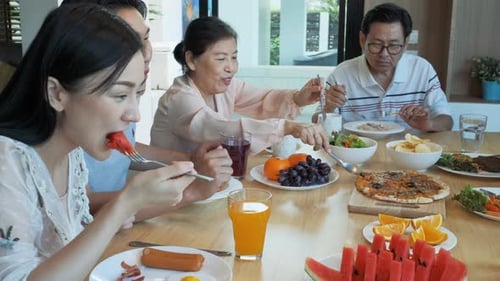 Family and Friends Enjoying a Meal Together Indoors