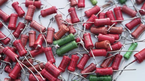 Heap of Red and Green Electronic Capacitors