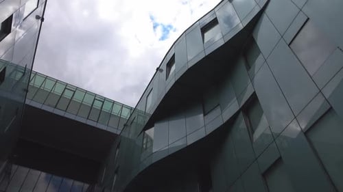 Modern Architecture Reflects Sky in Unique Building Design