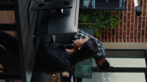 Colleagues Working Together in a Modern Urban Office