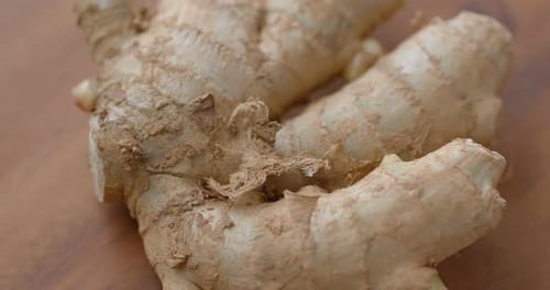 Close Up of a Ginger Root on Wood