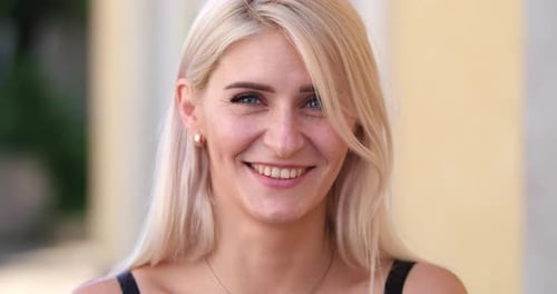 Blonde Woman Smiling in Close Up Portrait