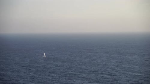 Sailing Ship Luxury Yacht with White Sails in the Sea in the Evening Sunlight