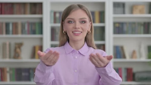 Portrait of Woman Pointing at the Camera and Inviting