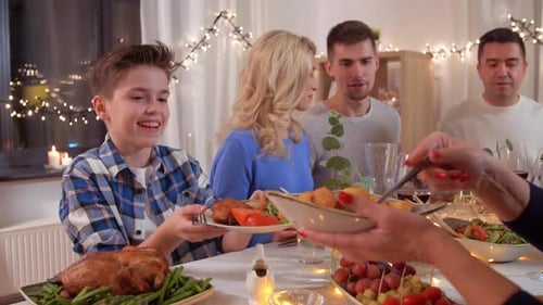 Family Celebrates Christmas Dinner at Home