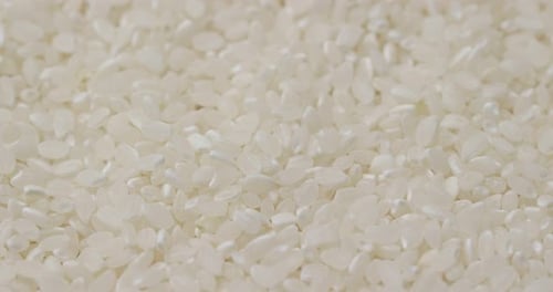 Stack of white uncooked rice