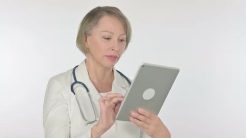 Mature Doctor Using Tablet in Medical Setting