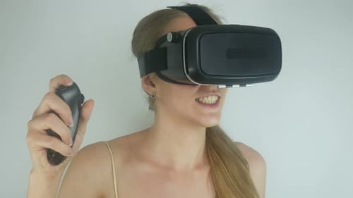 Woman Using VR Headset and Controller Device