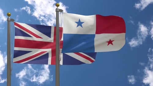 Flags of United Kingdom and Panama Waving Against Blue Sky