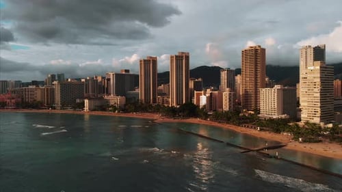 Aerial drone footage of Honolulu, Hawaii.
Beautiful real estate, buildings in the city.
Palm trees