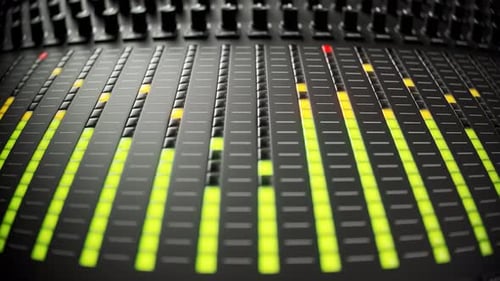 Colorful led lights indicating sound volume levels on a studio mixer. 4KHD