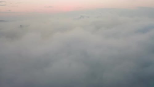 Drone View of the City Bay and Big Bridge Covered with Fog at Sunset
