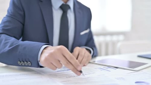 Businessman Working on Documents Paperwork