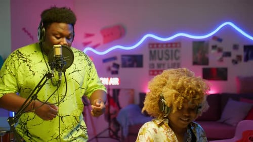 Musicians Collaborate on Song in Music Studio