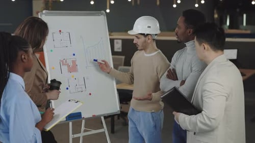 Diverse Team Collaborating on Architecture Project in Office