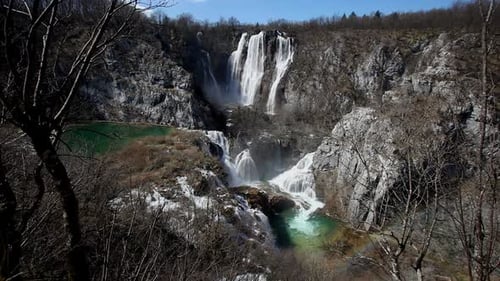Powerful Waterfall Cascading into Turquoise Pool