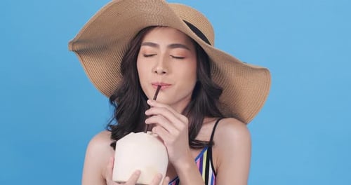Woman drink coconut water