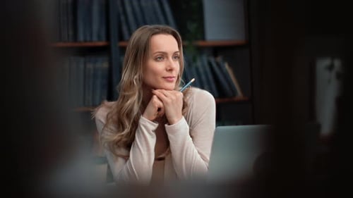Pensive Business Woman Thinking Planning in Front of Laptop Working at Library Workplace Room